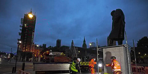 Scaffolders erect boarding around the statue of Sir Winston Churchill at Parliament Square, in London, Thursday, June 11, 2020. (Photo | AP)