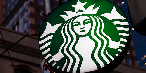 This June 26, 2019, file photo shows a Starbucks sign outside a Starbucks coffee shop in downtown Pittsburgh. (Photo | AP)