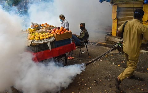 A BMC worker carries out fumigation work as part of the preventive measures against malaria ahead of Monsoon season at Mazgaon in Mumbai. (Photo | PTI)