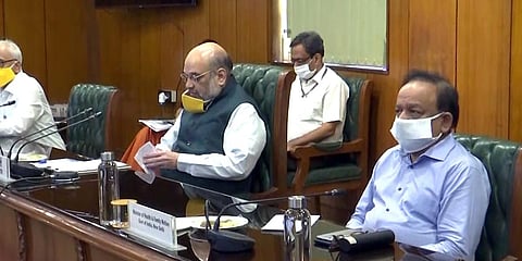 Union Home Minister Amit Shah and Health Minister Dr Harsh Vardhan chair a meeting with Delhi Chief Minister Arvind Kejriwal in New Delhi. (Photo| ANI)