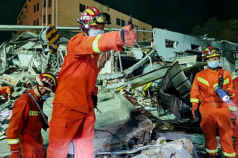Firefighters work amongst collapsed buildings in the aftermath of a tanker truck explosion near a highway in Wenling in eastern China's Zhejiang province Saturday, June 13, 2020. (Photo | AP)