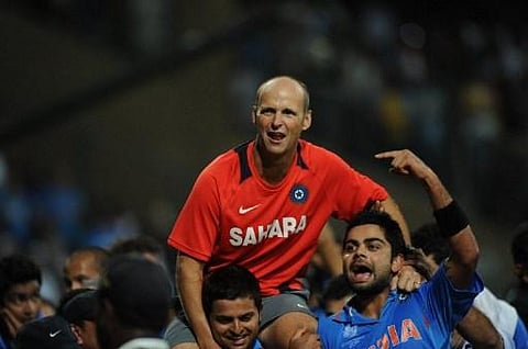 Indian cricketers hoist Gary Kirsten (C) onto their shoulders after victory in the Cricket World Cup 2011 final. (Photo | AFP)