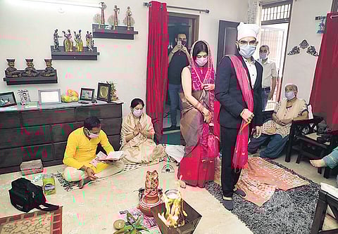 Chaitali and Nitin share a laugh; with family members during the pheras