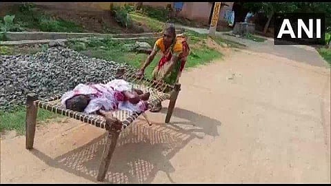 An old woman takes her mother to the bank for pension. (Photo| ANI)