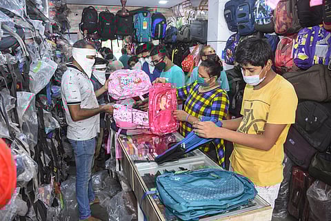 People buy school bags and other items at a shop ahead of the re-opening of schools during COVID-19 lockdown 5.0 in Surat Monday June 1 2020. (Photo | PTI)