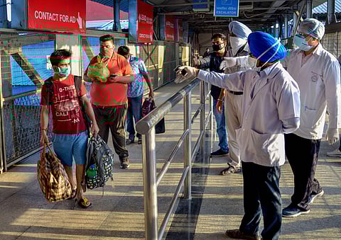 Passengers undergo thermal scanning on their arrival at the Amritsar Railway Station to board a train in Amritsar Monday June 1 2020. (Photo | PTI)