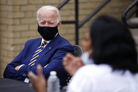 Democratic presidential candidate, former Vice President Joe Biden, left, listens as Carlette Brooks, owner of Carlette's Hideaway, a soul food restaurant, talks during a meeting with small business owners, Wednesday, June 17, 2020, in Yeadon, Pa. (Photo 