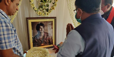 Union minister Ravi Shankar Prasad pays a floral tribute to late actor Sushant Singh Rajput's picture. (Photo| Twitter)