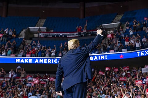 President Donald Trump arrives on stage to speak at a campaign rally. (Photo | AP)