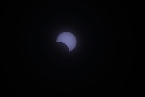 Indians look up at the sky for a glimpse of the rare 'ring of fire' solar eclipse 2020