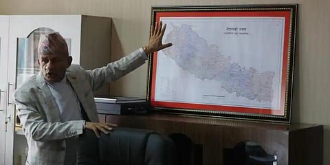 Nepal Foreign Minister Pradeep Gyawali points to a map of Nepal in Kathmandu. (File Photo | AP)
