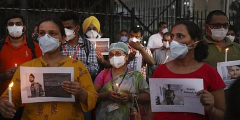 People hold candle to remember the Indian soldiers who were killed by China's PLA during a border standoff at Ladakh. (Photo | EPS)