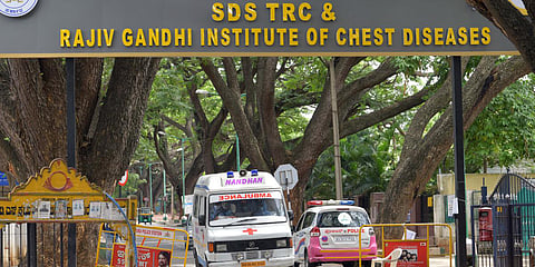 An ambulance leaves gates of RGICD, which has been receiving a huge number of Covid cases, in Bengaluru. (Photo| Meghana Sastry, EPS)