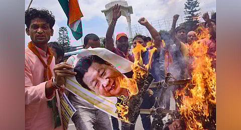 BJP activists burn an effigy of Chinese President Xi Jinping during a protest against the killing of 20 Indian Army soldiers in Ladakh's Galwan Valley by the Chinese troops, in Patna. (Photo | PTI)