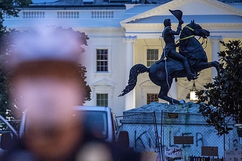 The equestrian statue of former US President General Andrew Jackson has ropes and chains still hanging, after protesters tried to topple it, at Lafayette square, in front of the White House, in Washington, DC. (Photo | AFP)