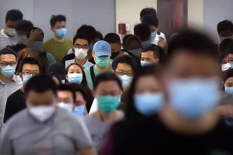 Commuters wear face masks to protect against the new coronavirus as they walk through a subway station in Beijing, Tuesday, June 23, 2020. (Photo | AP)