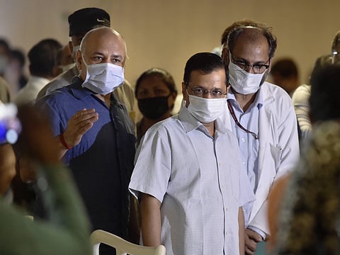 Delhi CM Arvind Kejriwal during the inauguration of an emergency COVID-19 care centre at LNJP Hospital Annexe in New Delhi Wednesday June 24 2020. Deputy CM Manish Sisodia and JNPL LNJP Medical Superintendent Suresh Kumar are also seen. (Photo | PTI)