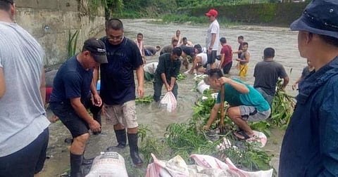 Images shared by Bhutan Foreign Ministry show workers clearing the irrigation channel for Assam. (Photo | Twitter)