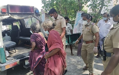 Some of the men watching tried to dissuade the inspector from helping as the woman was a rag picker and could have had contracted coronavirus. (Photo | EPS)