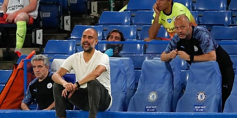 Manchester City's head coach Pep Guardiola reacts during the English Premier League match against Chelsea at Stamford Bridge. (Photo | AP)