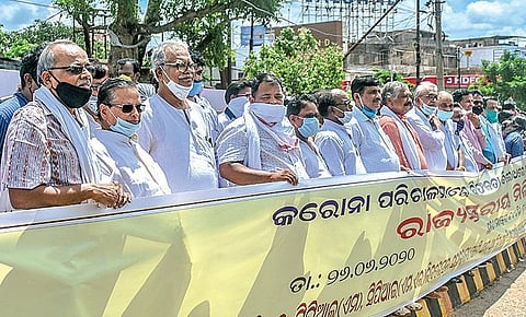 Leaders of Opposition political parties staging protest over Government’s failure in tackling corona crisis at Station Square in Bhubaneswar on Friday | EXPRESS