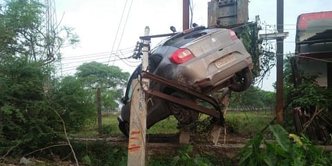 The car rammed into a divider, tossed up in the air for around 10 feet and got intertwined in the high tension wires.
