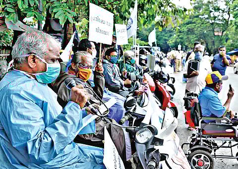 Differently-abled people protesting at Rajendra Maidan | Express
