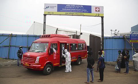 A bus carrying COVID-19 patients leaves a makeshift hospital to transport them to other hospitals as a precaution against Cyclone Nisarga in Mumbai. (Photo | AP)
