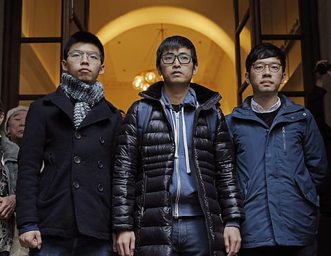 Pro-democracy activists Joshua Wong, Alex Chow and Nathan Law (Photo | AP)