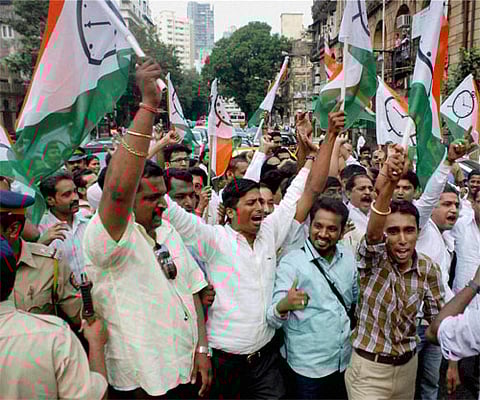 NCP supporters shout slogans during the protest in Mumbai on Thursday. PTI