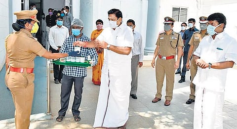 Chief Minister Edappadi K Palaniswami distributing ‘kabasura kudineer’ to police personnel at the Secretariat in Chennai. (File Photo| EPS)