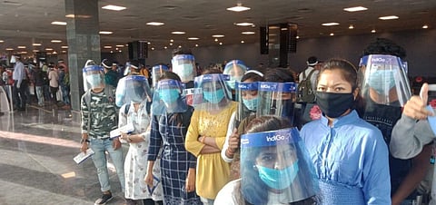 The Migrants who are flying to Chhattisgarh show their boarding passes. (Photo | Express)