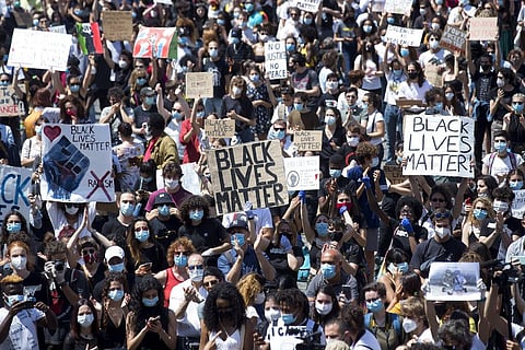 People gather in Rome's Piazza del Popolo square calling for justice for George Floyd, who died May 25 after being restrained by police in Minneapolis. (Photo | AP)
