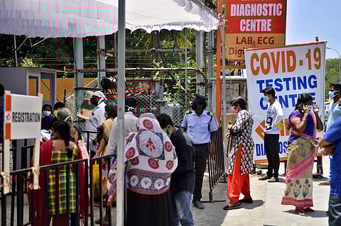 People waiting outside a private hospital COVID-19 testing center at Poonamalle High Road near Kilapuk in Chennai on Saturday. (Photo | Debadatta Mallick/EPS)