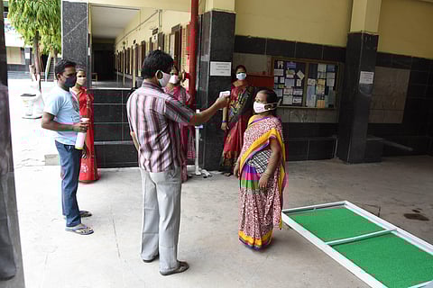 Staff of private schools getting thermal scanning in Hyderabad onb Thursday as schools are getting ready to conduct remaining 10th class exams which will be starting from 8th of June in Hyderabad. (Photo | RVK Rao/EPS)