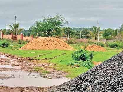 Sand stocked in a temporary stockyard in Haliyal taluk | Express