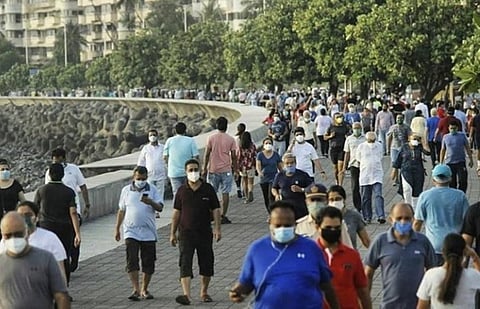 Mumbaikars spotted at Juhu beach with masks. (Photo | Twitter)