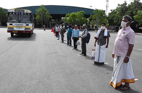 Passengers maintain social distance while boarding a bus to Tirumala at Alipiri toll gate on Sunday. (Photo | Madhav K, EPS)