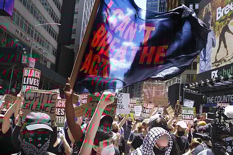 Black lives matter protesters rally near the edge of Times Square in New York, Sunday. (Photo | AP)