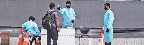 Staff of Galleria mall at Punjagutta check customers at the entrance on Sunday | Sathya Keerthi