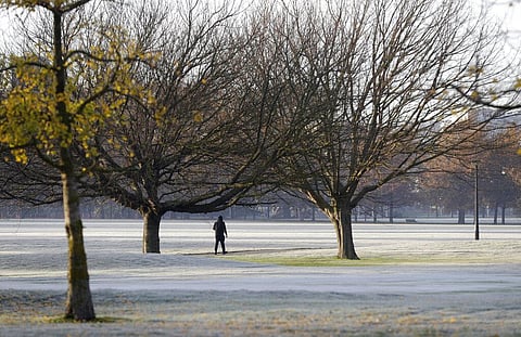 A man walks across the frost covered fairways of a golf course in central Christchurch, New Zealand, Saturday, June 6, 2020. (Photo | AP)
