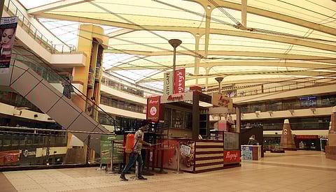 Man sanitizes a mall ahead of reopening on June 8 as allowed under Unlock 1. (Photo| EPS/ Shekhar Yadav)