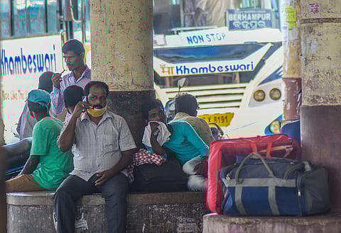 Passengers waiting for their bus at Baramunda bus stand during lockdown in Bhubaneswar. (Photo | Biswanath Swain, EPS)