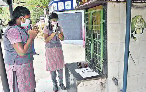 Class 10 students seek blessings at the Pilaiyar temple after collecting hall tickets from school on Monday in Chennai | P JAWAHAR