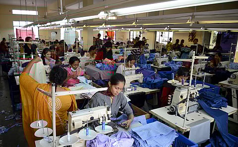 Garment workers at a unit in Peenya Industrial Estate, Bengaluru. (File photo | EPS)