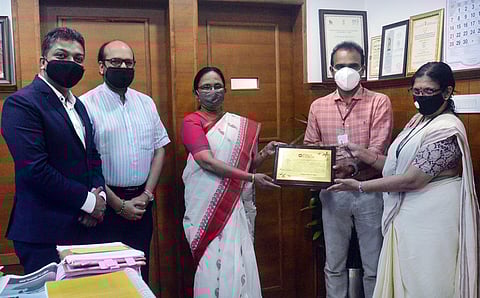 KK Shailaja presenting a memento to Dr Sulphi M Noohu, vice president, Indian Medical Association, as part of an initiative by The New Indian Express.