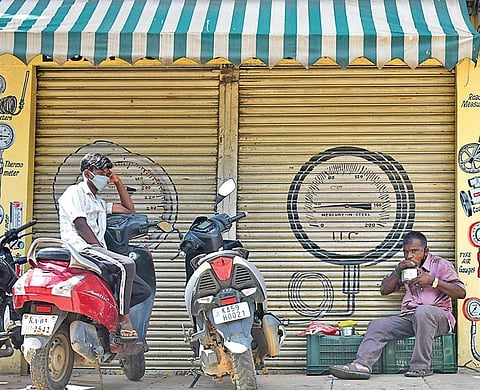 Shops and other establishments remain shut on Bengaluru’s SJP Road after  it was listed as a containment zone, on Saturday  |  Vinod Kumar T