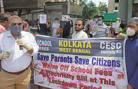 Parents stage demonstration demanding partial school fee waiver. (Photo| IANS)