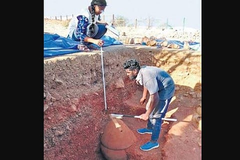 Students measuring an urn at a trench in Adichanallur | Express
