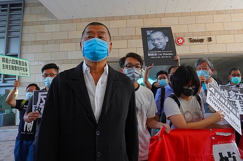 Hong Kong media tycoon Jimmy Lai, founder of the local newspaper Apple Daily, arrives outside a district court in Hong Kong. (Photo | AP)